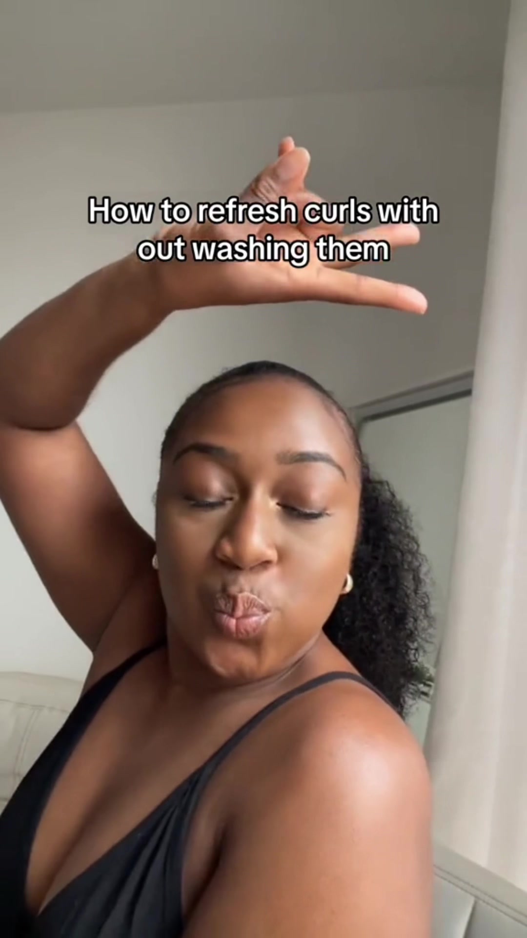 Refreshing natural curls between wash days on TikTok.